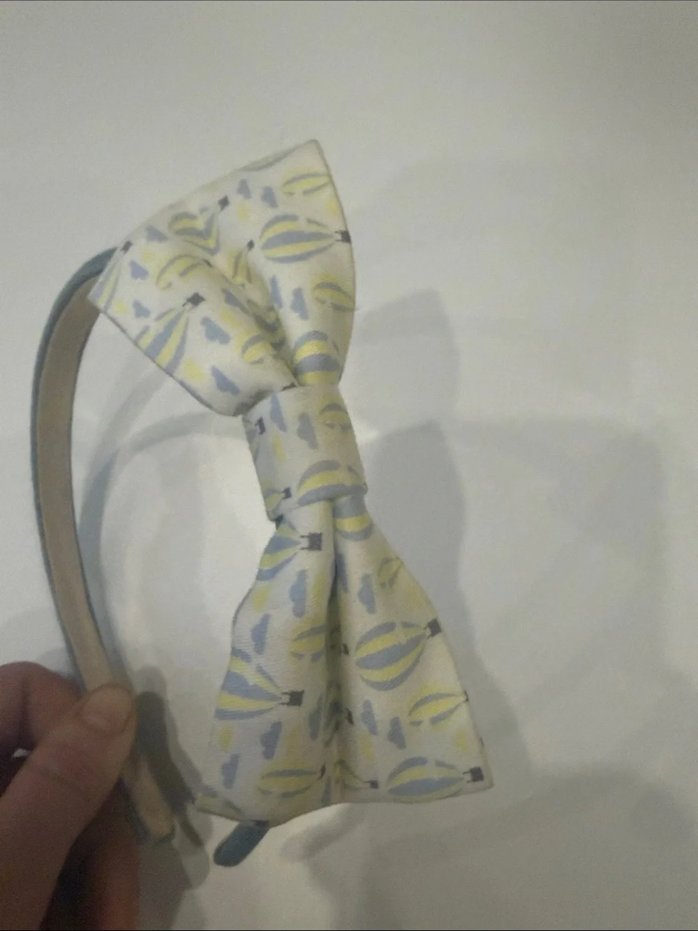 Blue Fabric Headband with Patterned Yellow Bow Accent
